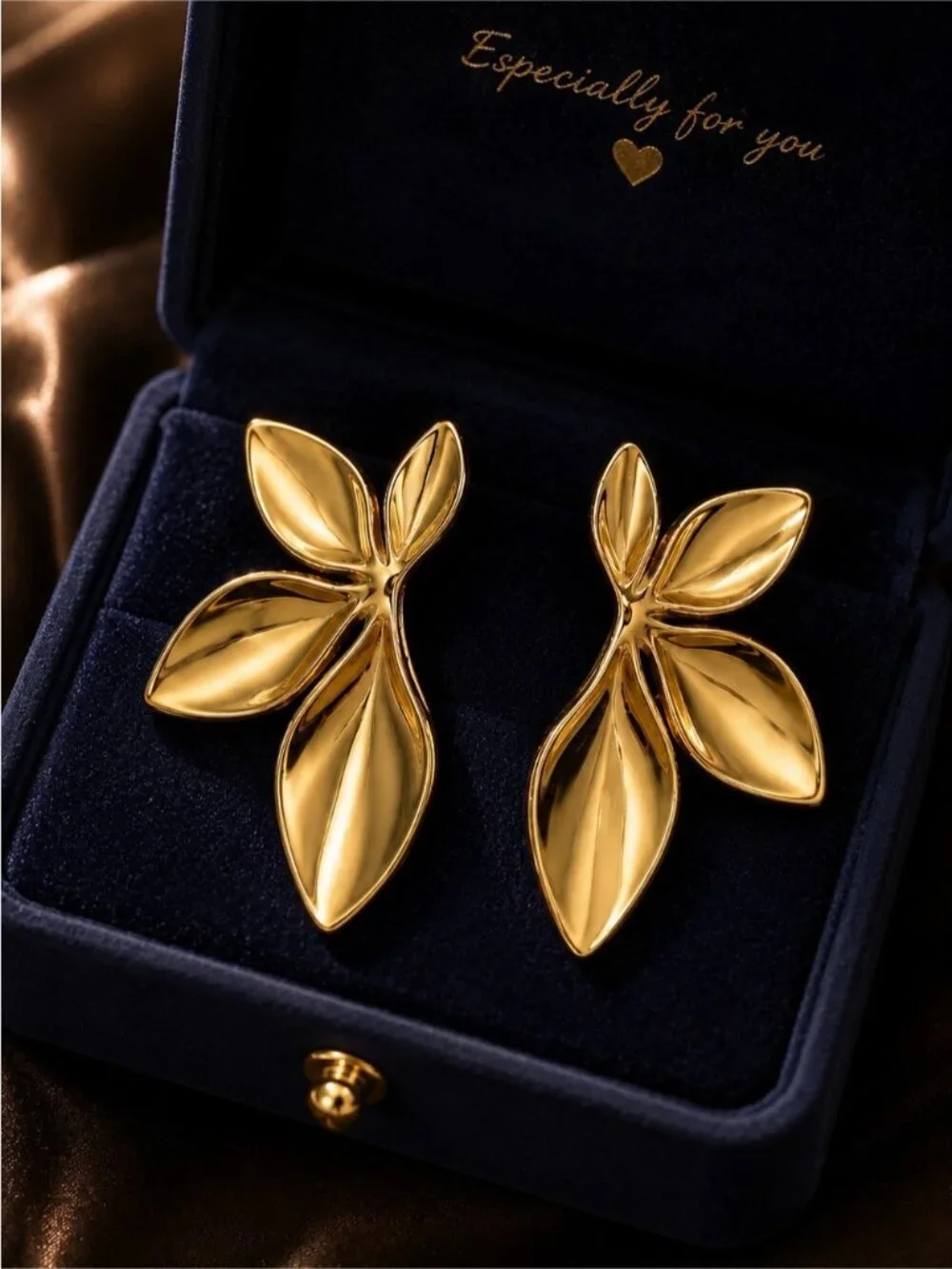 Stainless steel leaves in gold tone stud earrings